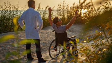 doctor traveling with a wheelchair patient