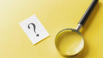 magnifying glass with printed question mark